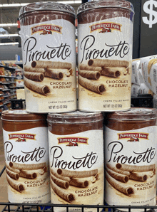 several cans of pirouette chocolate hazelnut creme filled wafers