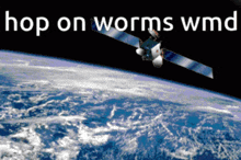 a satellite is flying over the earth and the words hop on worms wmd are above it