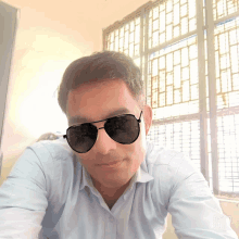 a man wearing sunglasses is taking a selfie with the hashtag b612