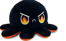 a black and orange stuffed octopus with a fire embroidered on its eyes .