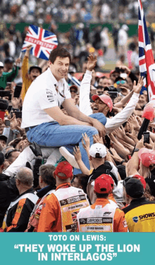 a man carrying another man on his shoulders with the caption " toto on lewis they woke up the lion "