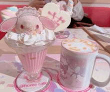 there is a cup of coffee and a sundae on the table .