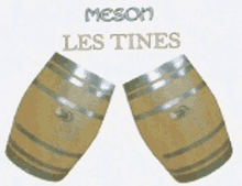 two wooden barrels are sitting next to each other on a white background with the words meson les tines written above them