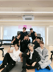 a group of young men posing for a picture in a gym