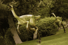 a statue of a dinosaur with a long neck and long legs