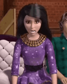 a barbie doll is wearing a purple dress and a gold necklace .