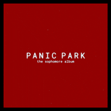 a red background with panic park the sophomore album in white letters