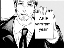 a man in a suit and tie is holding a piece of paper that says akif