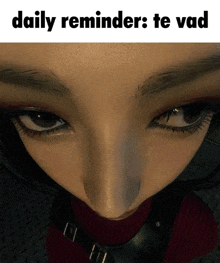 a close up of a woman 's face with the words daily reminders te vad