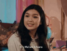 a girl says it 's ma 'am chiara in front of a mirror