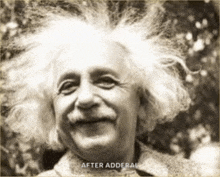 a black and white photo of albert einstein smiling