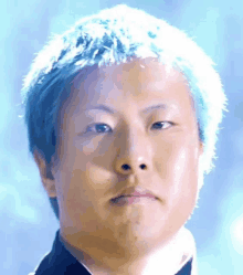 a close up of a man with blue hair