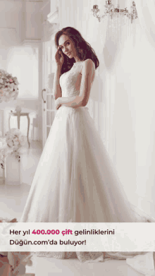 a woman in a wedding dress is standing in a room with flowers