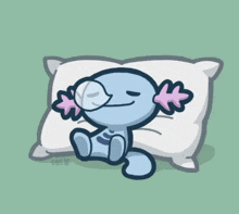 a cartoon drawing of an axolotl sleeping on a white pillow