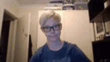 a blurry picture of a young man wearing glasses