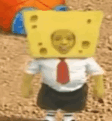 spongebob is wearing a piece of cheese on his head and tie .