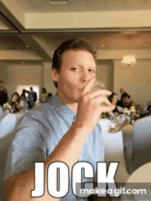 a man is drinking from a glass with the word jock written on the bottom