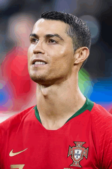 a close up of a soccer player wearing a jersey that says portugal on it