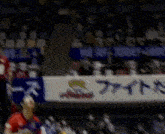 a volleyball player with the number 9 on his back is jumping in the air