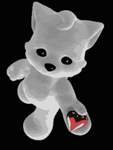 a white teddy bear holding a red heart in its paw .