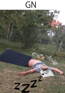 a picture of a man laying on the ground with the word gn below him