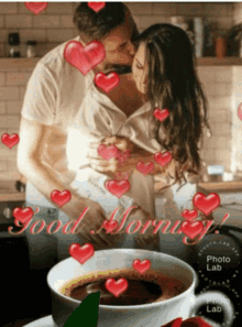 a man and woman kissing in front of a cup of coffee that says good morning photo lab