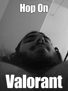 a black and white photo of a man with the words hop on valorant above his head