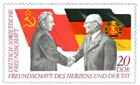 two men shaking hands on a postage stamp that says deutsch-sovjetische freundschaft des herzens und der tat