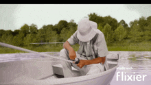 a man is fishing in a boat with the words made with flixier