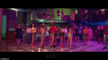 a group of women are dancing in a club with the words tseries.official at the bottom .