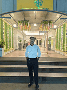 a man stands in front of a building with a sign that says lemonade