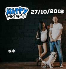 a man and a pregnant woman standing next to a dog with the date 27/10/2018 on the bottom