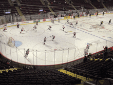 a hockey game is being played in a stadium with a jeep ad on the wall