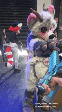 a person in a furry costume is holding a minecraft sword