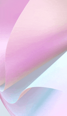 a close up of a pink and blue paper