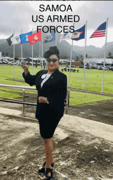 a woman stands in front of a field of flags with the words samoa us armed forces written above her