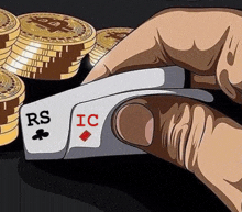 a person is holding a playing card with rs and ic on it .