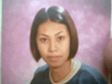 a blurry photo of a young woman with short hair