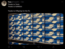 a bunch of nike boxes are stacked on top of each other on a shelf