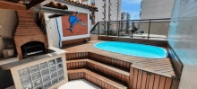 a blue dolphin is painted on the wall above a pool