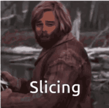 a man with a beard is standing in front of a sign that says ' slicing ' .