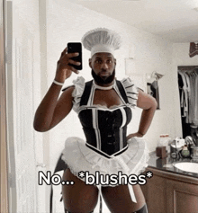 a man in a maid costume takes a picture of himself in a mirror