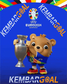 a teddy bear is holding a trophy in front of a blue background that says kembar goal