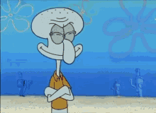 squidward from spongebob squarepants is standing on a beach with his arms crossed and smiling .