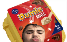 a box of dumle eggs with a picture of a man