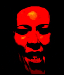 a close up of a person 's face with a red light on it