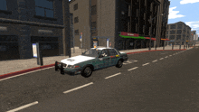 a green and white police car is parked on a city street