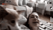 a video of a woman and a dog being recorded