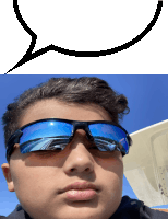 a boy wearing sunglasses looks at the camera with a speech bubble behind him