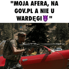 a man holding a rifle in front of a red car with the words " moja afera " on the bottom